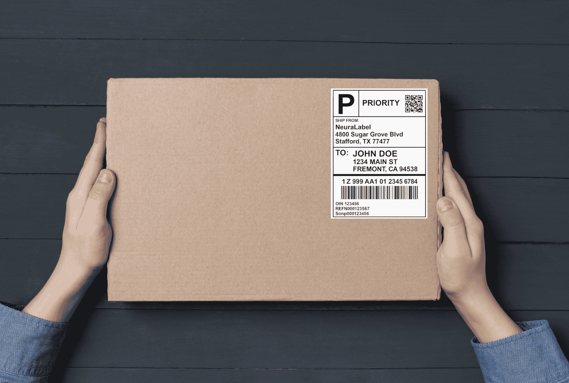 Box with barcode label being carried